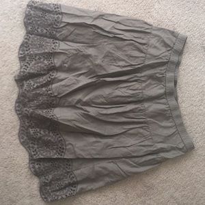 Small, brown skirt with patterned hem